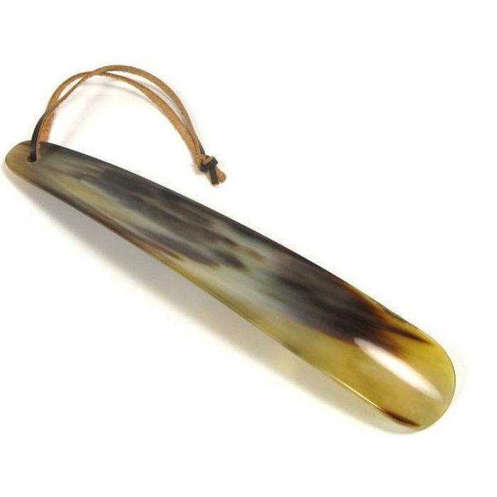A flat-shaped shoe horn made of natural horn with a brown leather thong strap.