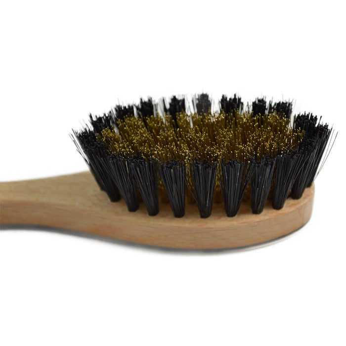 A hand crafted suede brush with a boar bristle head and an oxhorn back attached to a beechwood handle.