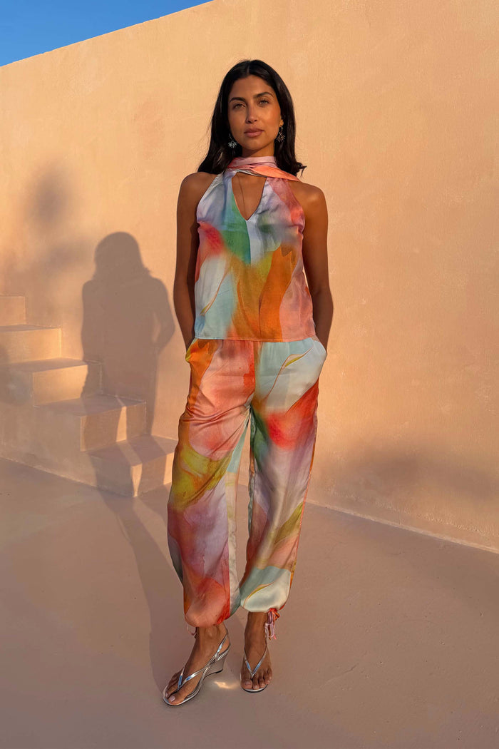Abstract Lily Top with a vibrant multicoloured print and multi-wear tie neckline, styled as a co-ord.