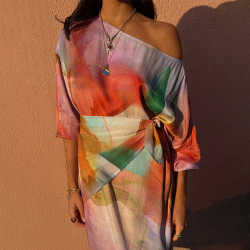 Abstract Scarf in vibrant watercolour tones, styled as a multi-wear waist tie on a matching printed dress.