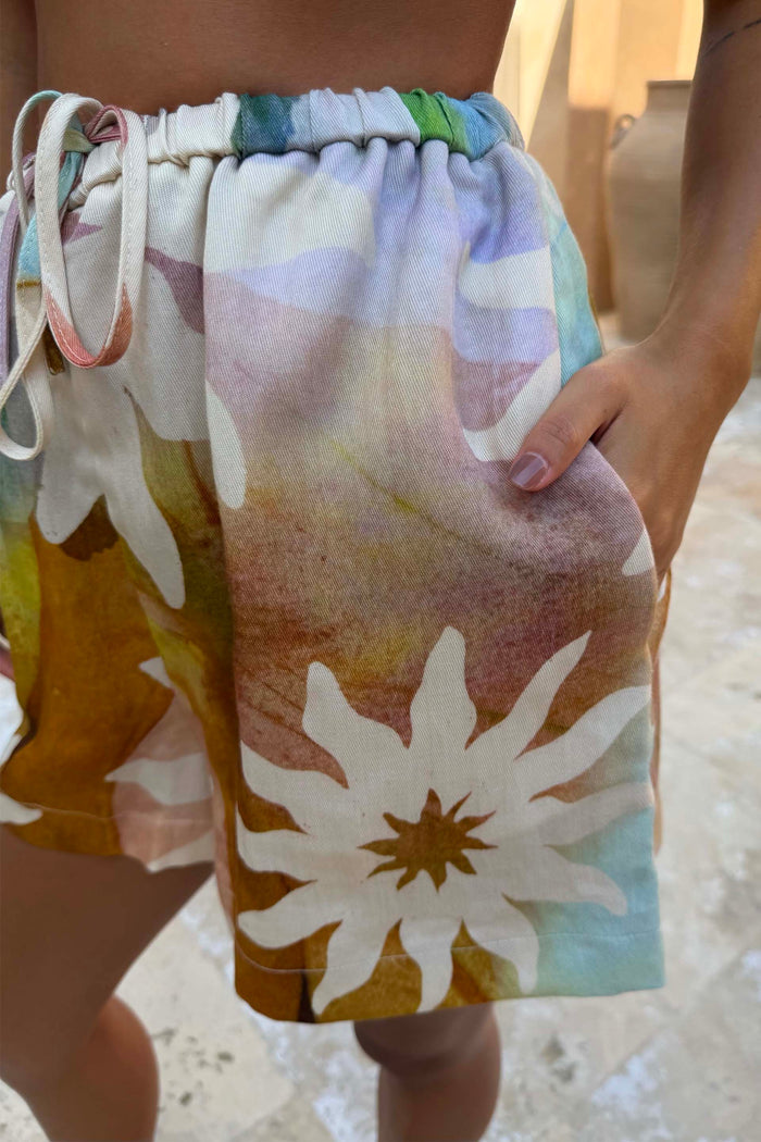 Abstract Soleil Ellie Shorts in a multicoloured sun print with an elasticated drawstring waist and side pocket.