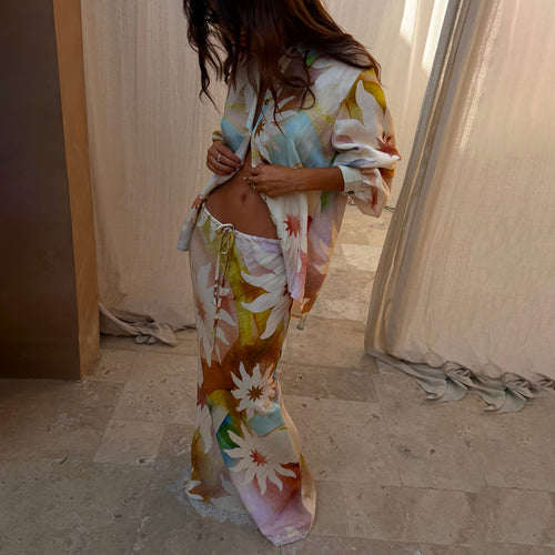 Abstract Soleil Mabel Skirt with sun motifs, a drawstring waist and lace hem detailing, paired with a matching shirt.