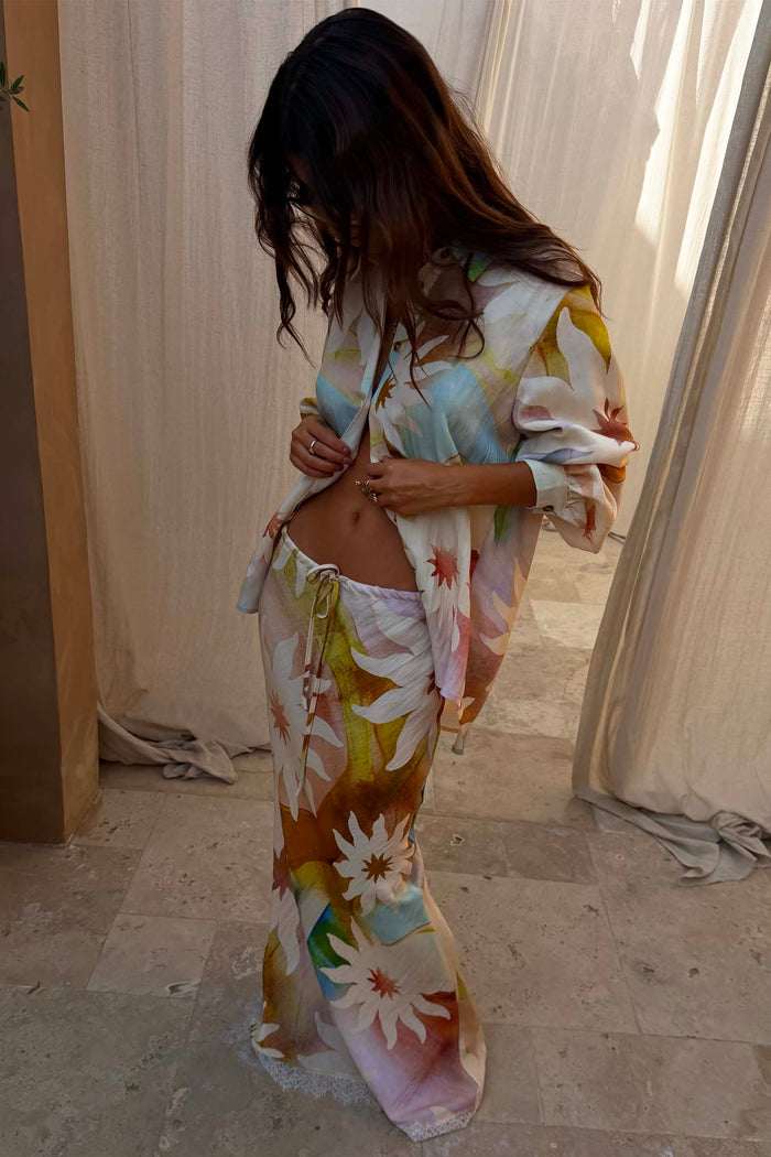 Abstract Soleil Mabel Skirt with sun motifs, drawstring waist and lace hem, styled as a chic co-ord.