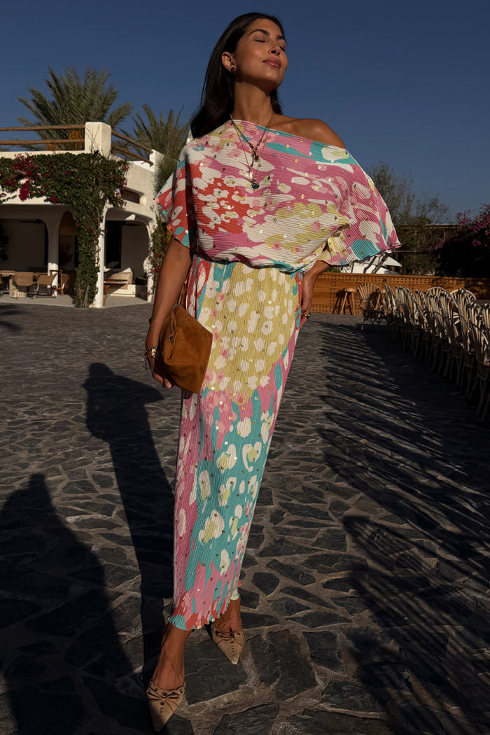 Animal Print Tilly Dress with a pleated texture and silver metallic flecks, styled for a summer vacation.