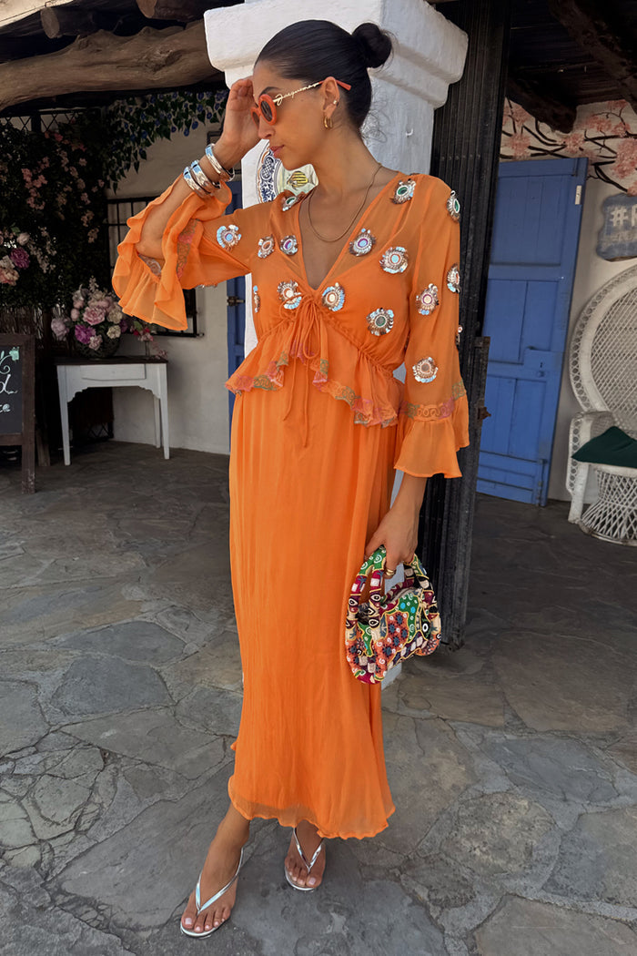 Apricot Embellished Ines Dress featuring mirror detailing and ruffled sleeves for a summer vacation look.