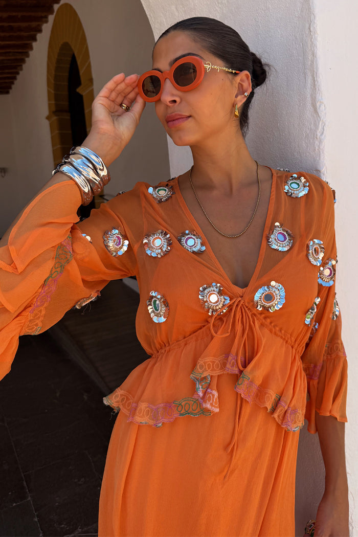 Apricot Embellished Ines Dress in orange with mirror detailing and a peplum hem.