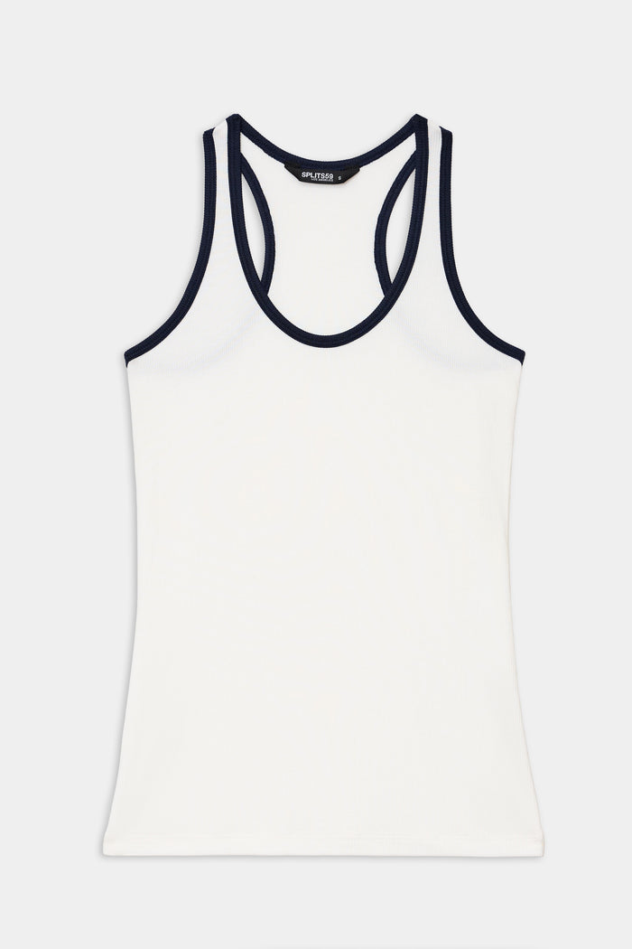 The SPLITS59 Ashby Rib Tank in White/Indigo is a sleeveless workout top featuring indigo trim on the neckline and armholes, made from soft baby rib fabric and displayed flat on a plain background.