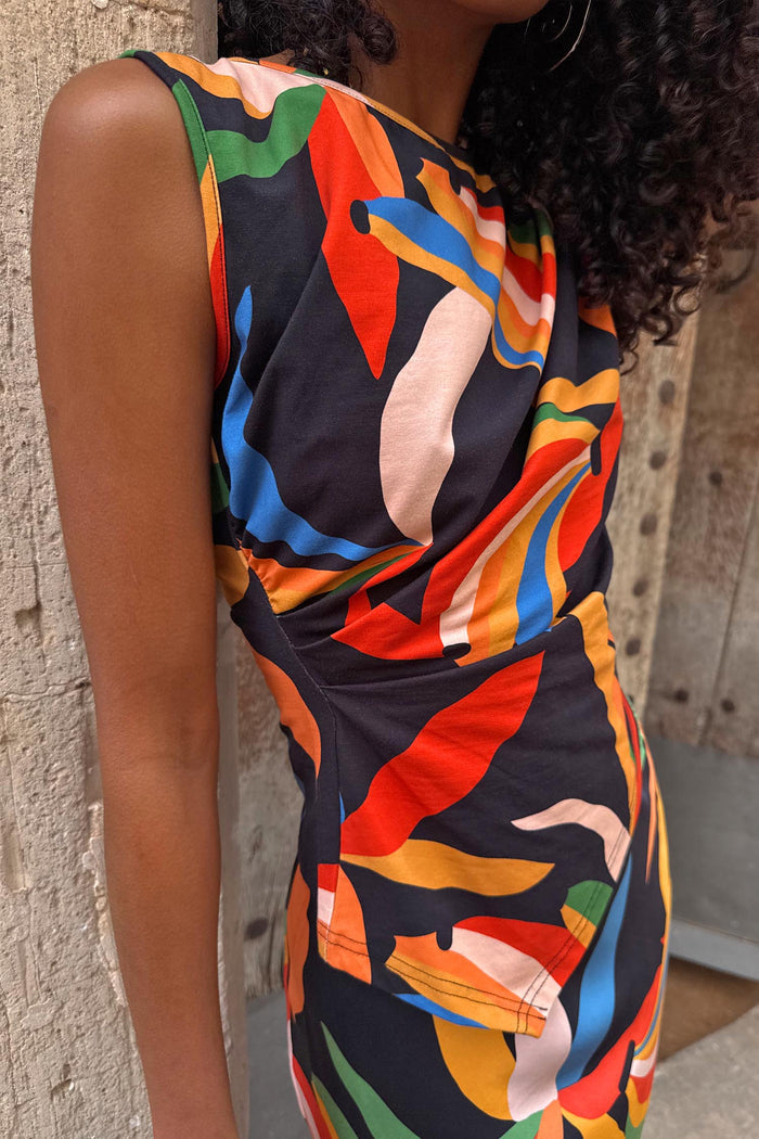 Banana A-Symmetric Top with multicoloured banana motifs on black jersey, featuring an asymmetric neckline and gathered waist.