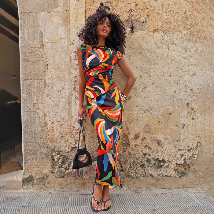Banana Dorris Skirt in a vibrant multicoloured print on soft black jersey, styled as a matching co-ord set.