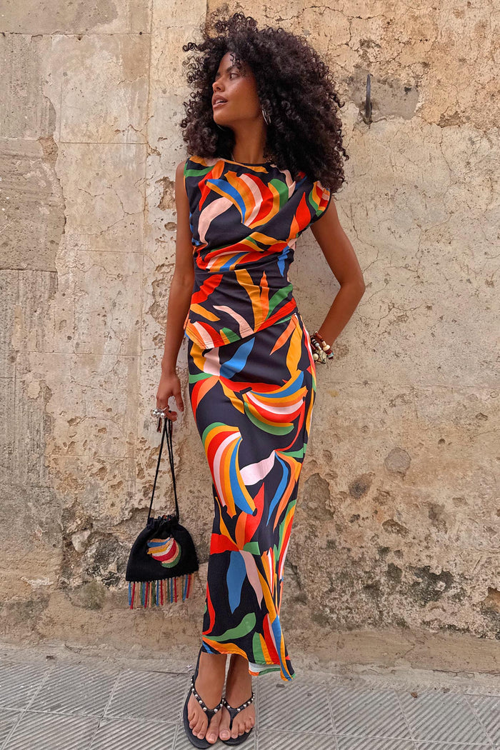 Banana Dorris Skirt with a hand-painted multicoloured print on black jersey, designed in London and styled as a co-ord.