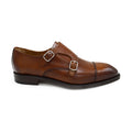 A brown Berwick 1707 double monk shoe with double buckle monk strap on a white background.