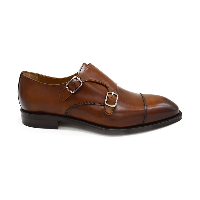 A brown Berwick 1707 double monk shoe with double buckle monk strap on a white background.