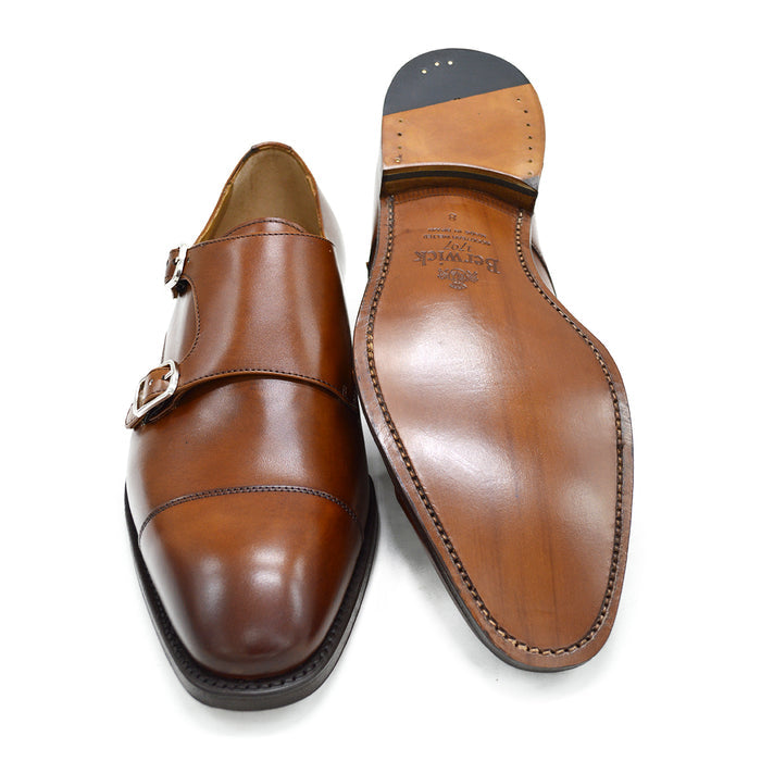 A brown Berwick 1707 double monk shoe with double buckle monk strap on a white background.