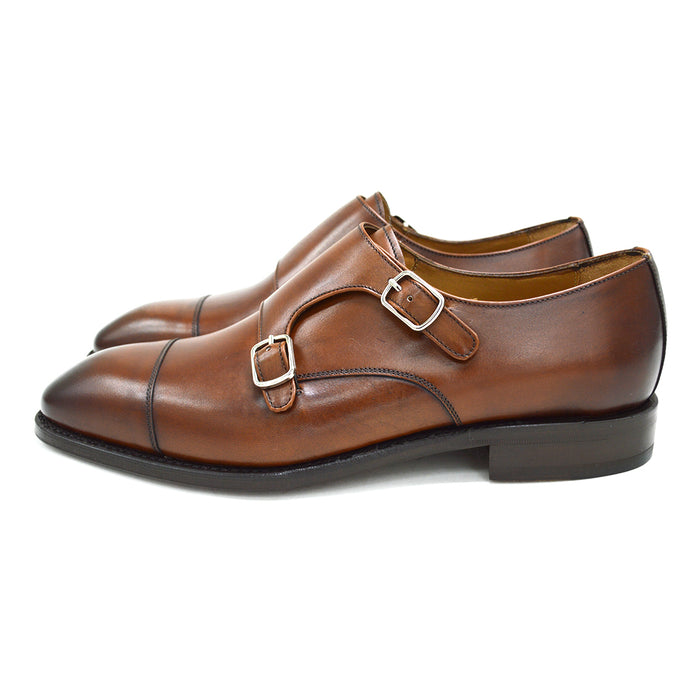 A brown Berwick 1707 double monk shoe with double buckle monk strap on a white background.