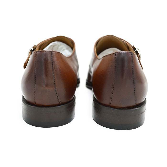 A brown Berwick 1707 double monk shoe with double buckle monk strap on a white background.