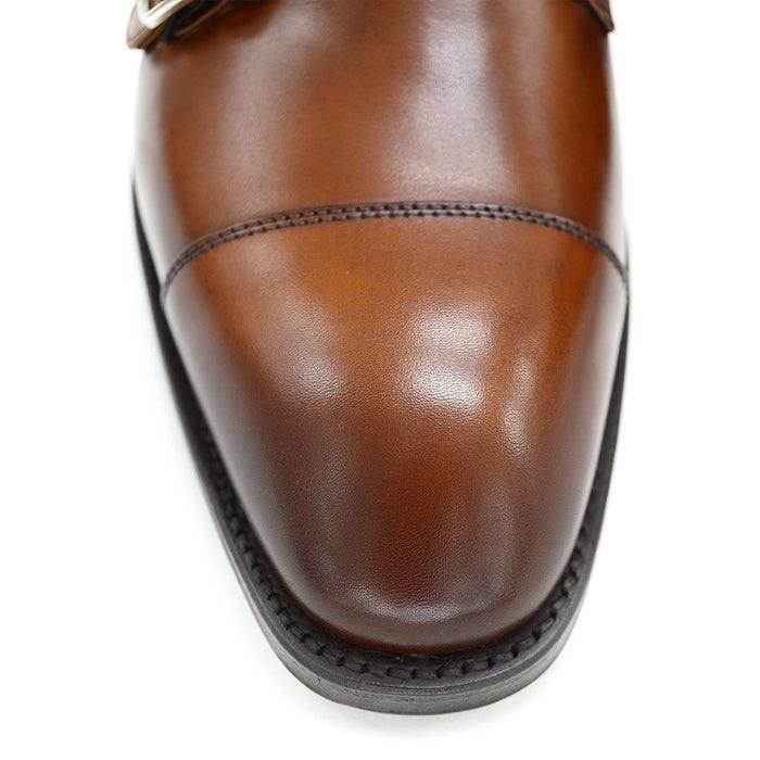 A brown Berwick 1707 double monk shoe with double buckle monk strap on a white background.