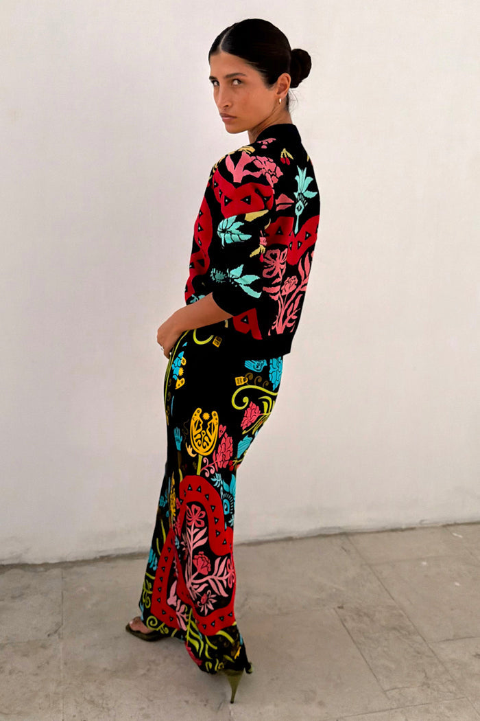 Black Amara Dorris Skirt featuring hand-painted motifs in a relaxed midi silhouette, designed in London.