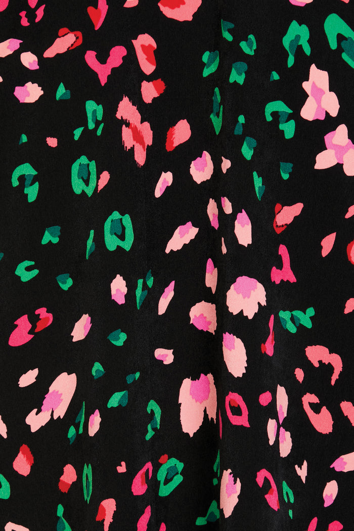 Close-up of the Black Animal Verity Top showcasing pink, red, and green leopard print on a black background.