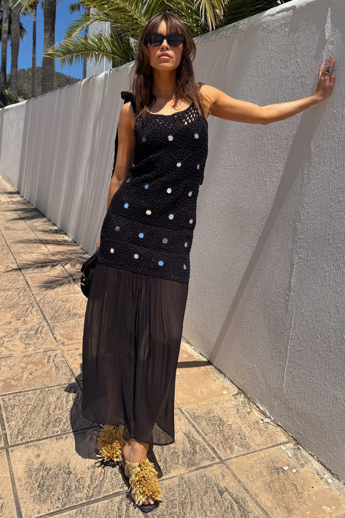 Black Crochet Alicia Dress with silver sequins and a gathered chiffon skirt, styled for vacation wear.