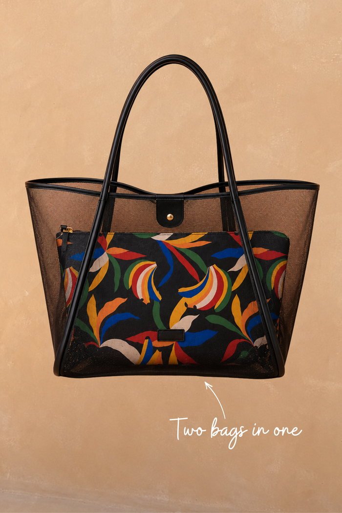 Black mesh tote bag with leather straps and a detachable multi-coloured banana print pouch inside.