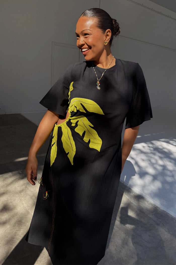 Black Palm Riviera cotton blend maxi dress featuring an iconic lime palm motif and waist cut out.