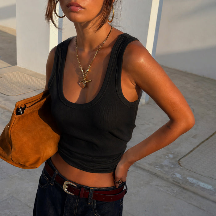 Black Scoop Neck Rib Tank with a soft ribbed finish, styled with denim and a tan bag for a classic London look.