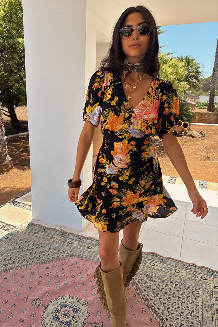 Black Sofia Mini Tea Dress with an orange and blue floral print, v-neckline and frill hem detail.