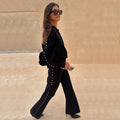 Black Studded Knit Trousers with silver metal studs, styled as a monochrome co-ord with a matching cardigan.