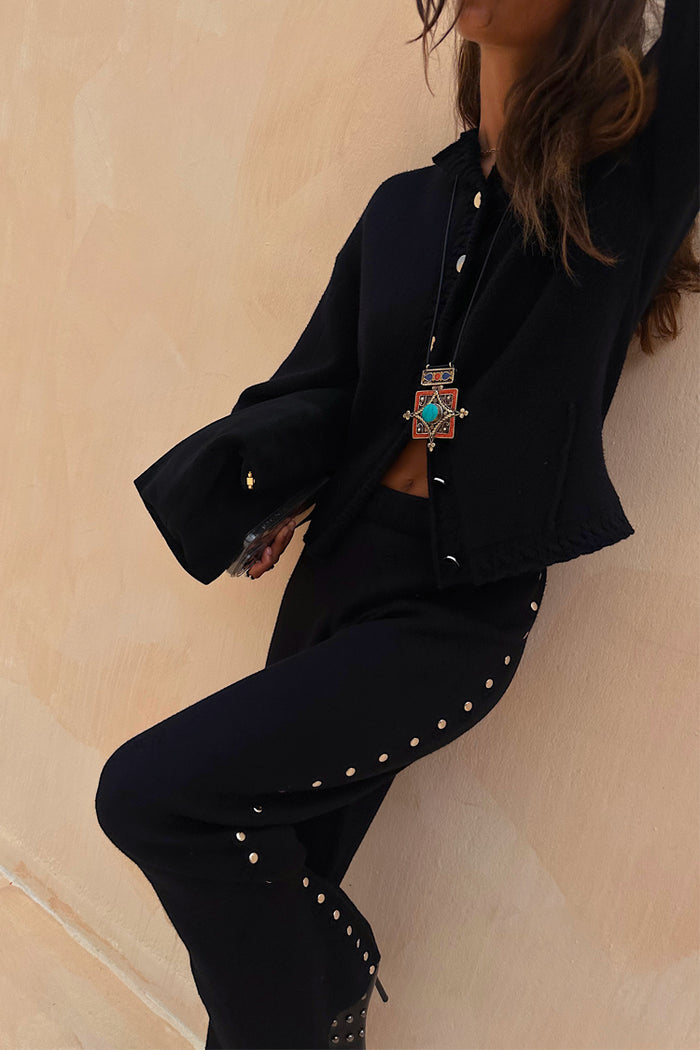 Black Studded Knit Trousers featuring silver metal studs down the leg, styled as a soft knitwear co-ord.