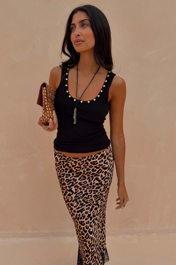 Black Studded Rib Vest with gold studs at the neckline, styled with a leopard print skirt.