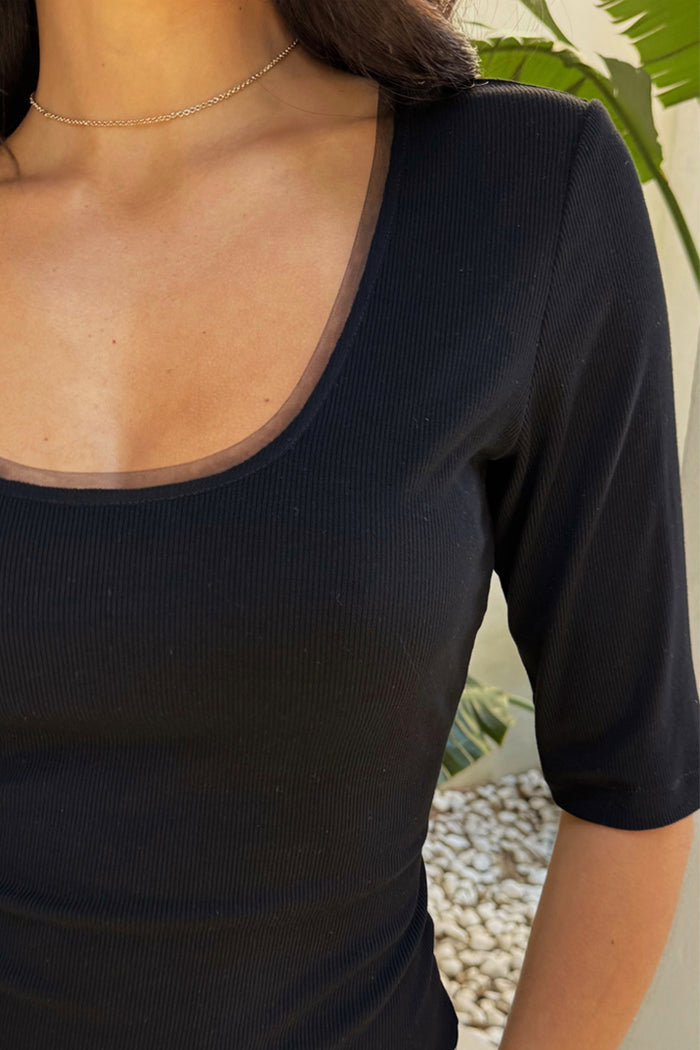 Black Teddy T-Shirt featuring a ribbed texture and mesh detailing along the scoop neckline.