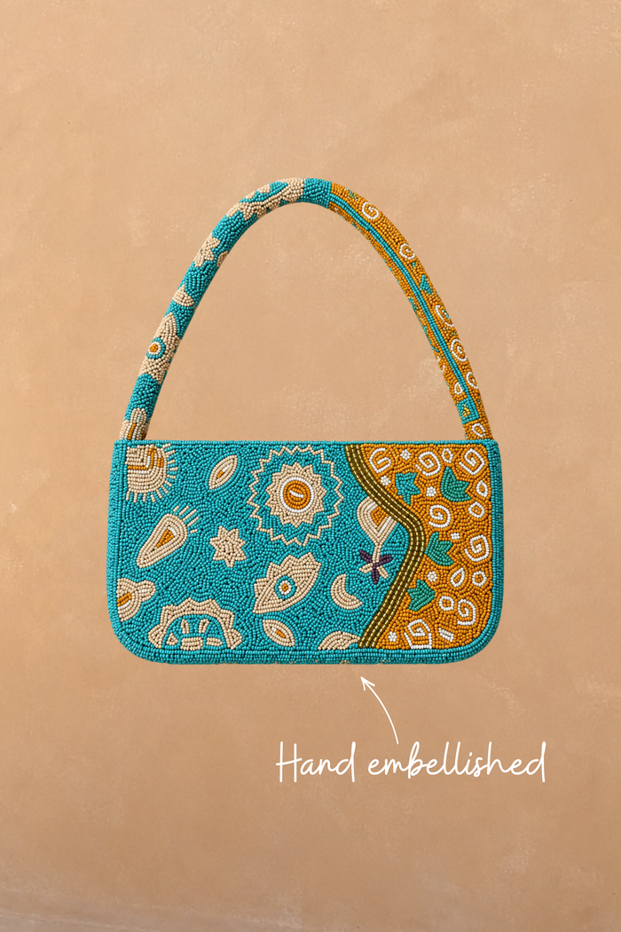 Blue and Yellow Morocco Beaded Bag featuring hand-embellished glass beads and iconic motifs in a Morocco print.