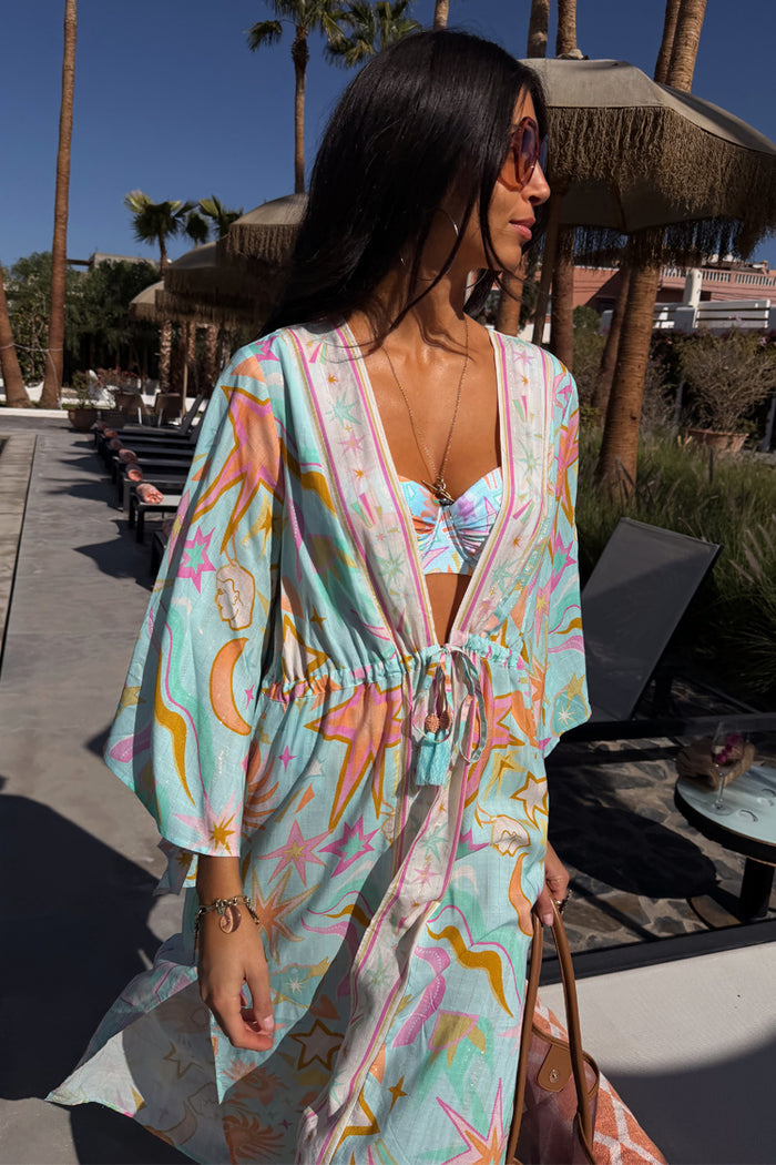 Blue Dreamer Underwired Bikini Top with a pastel celestial print, layered with a matching kimono in a resort setting.