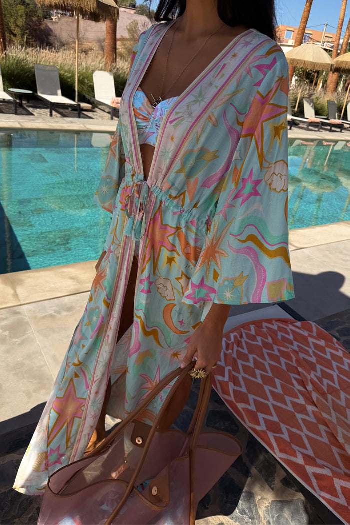Blue Dreamer Maxi Kimono with iconic palm and sun motifs, styled as a flowy poolside vacation cover-up with a tie waist.
