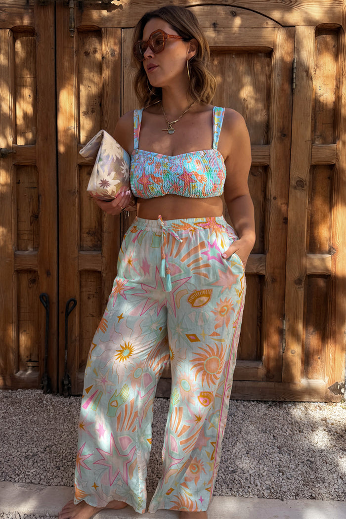 Blue Dreamer Trouser with a celestial sun and star print, elasticated tassel waist and wide-leg fit for a vacation look.
