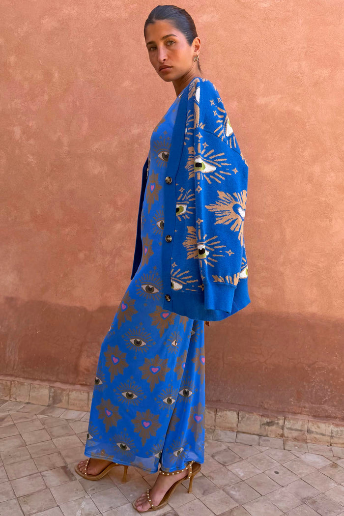 Blue Eye Mesh Dress and matching cardigan featuring eye motifs in a fitted maxi silhouette.