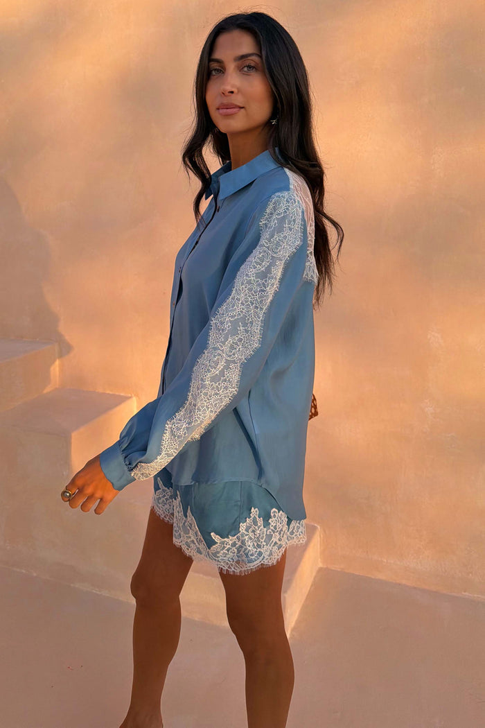 Blue Lace Marley Shirt featuring white lace panels on the sleeves and back, paired with matching shorts on a model.