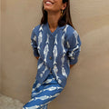 Blue Marina Hollie Cardigan in a soft knit with white fish motifs, paired with a matching skirt for feel good dressing.