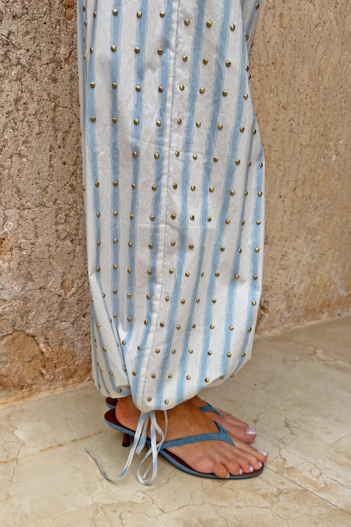 Blue Stripe Balloon Trouser with gold stud embellishments and adjustable tie-cuff detailing at the hem.