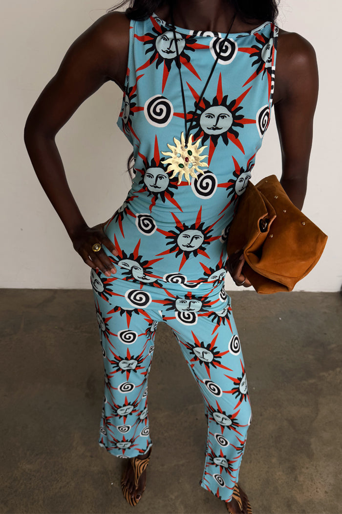 Blue Sun Foldover Trousers and matching vest jersey co-ord featuring hand-painted sun motifs.