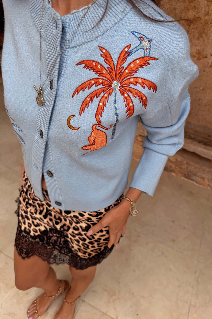 Blue Tigress Cardigan with embroidered palm tree and tiger, paired with a leopard print and lace skirt.