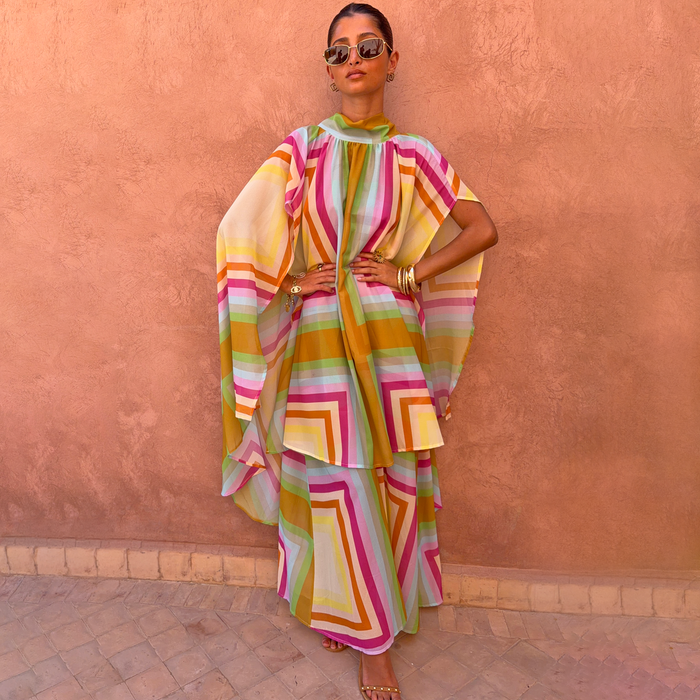 Bright Geo Stevie Maxi Dress with cape sleeves and a colourful geometric print, ideal for vacation evenings.