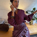 Burgundy Ruffle Miley Shirt with blouson sleeves, ruffle detail and tortoise buttons, styled with a matching skirt.