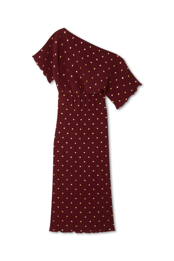 Burgundy Tilly Dress in gold-flecked plisse with an off-the-shoulder neckline, elasticated waist and lettuce hem.