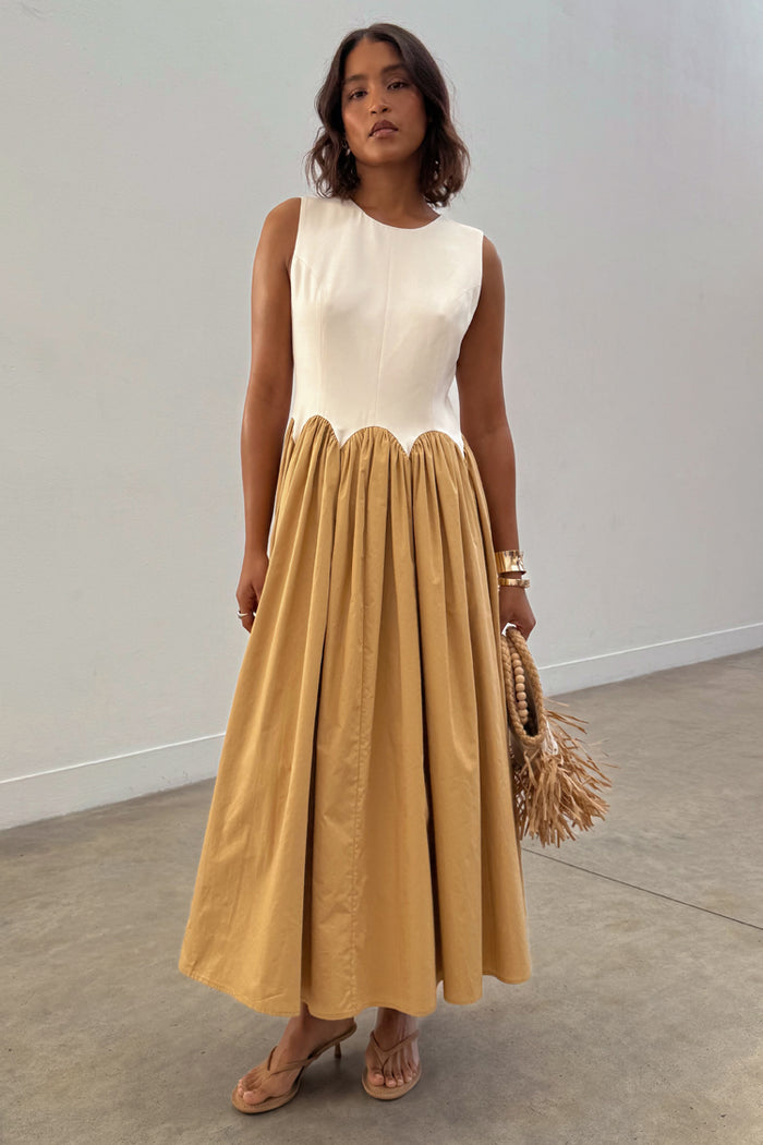 Camel Monika Dress with a panelled cream corset top, scalloped hem and a camel pleated cotton skirt.