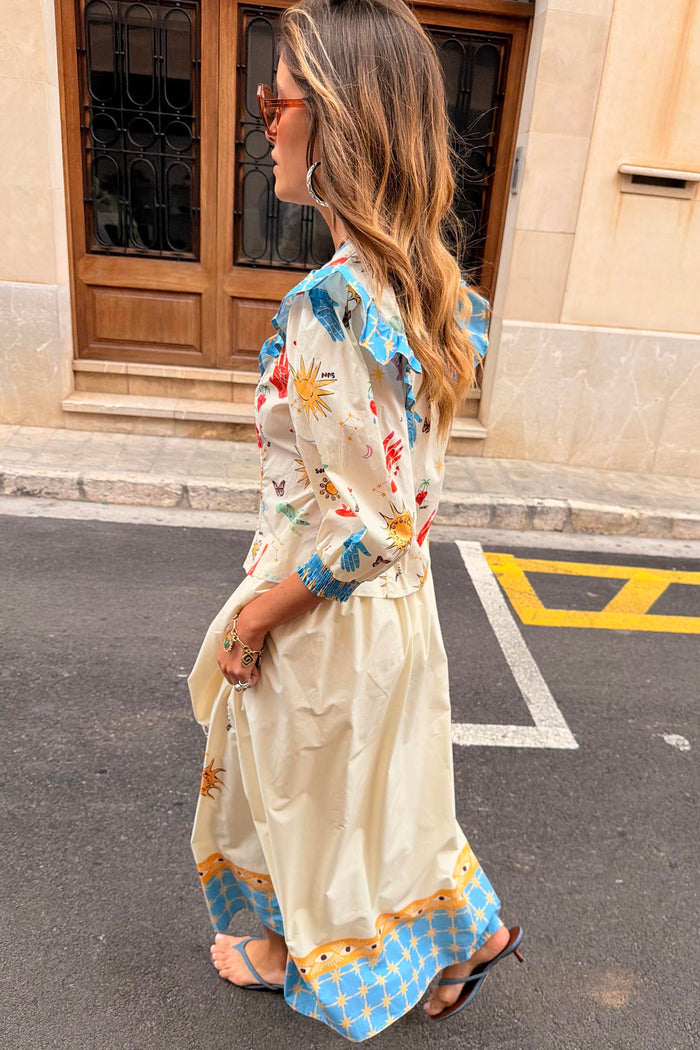 Celestial Talia Skirt in cream cotton featuring a blue celestial border print, styled with the matching Nia top.