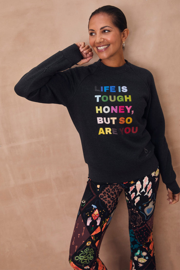 NFD Charcoal sweatshirt featuring a colourful Life is Tough Honey slogan and functional zip details.