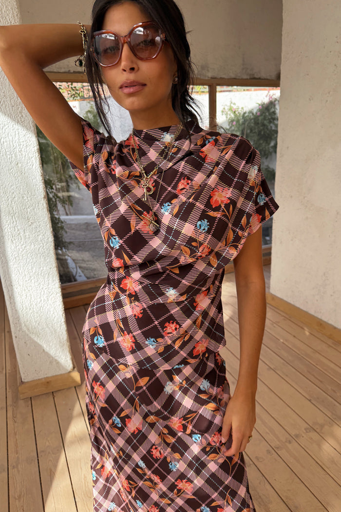 Chocolate Check Floral Top with a high neck, draped sleeves and ruched detailing, worn with sunglasses.