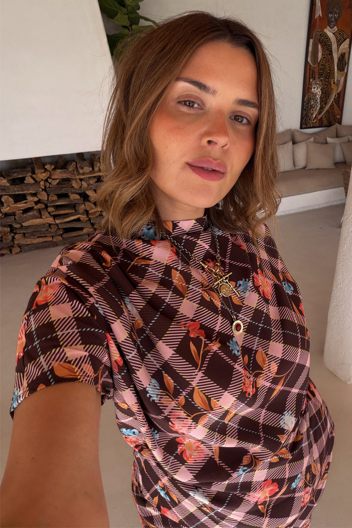 Chocolate check floral top with a high neck and draped sleeves on a model wearing UK size 18.