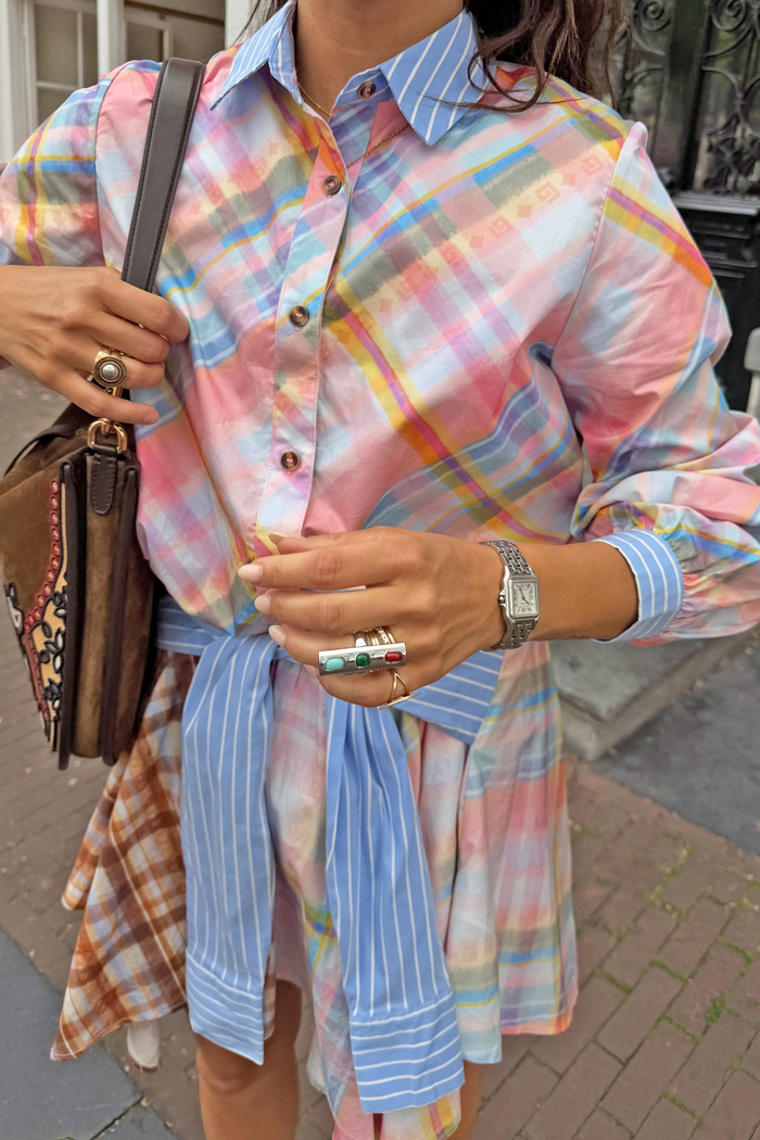 Pastel check shirt featuring a detachable blue striped pussy bow tied at the waist for a multi-wear London look.
